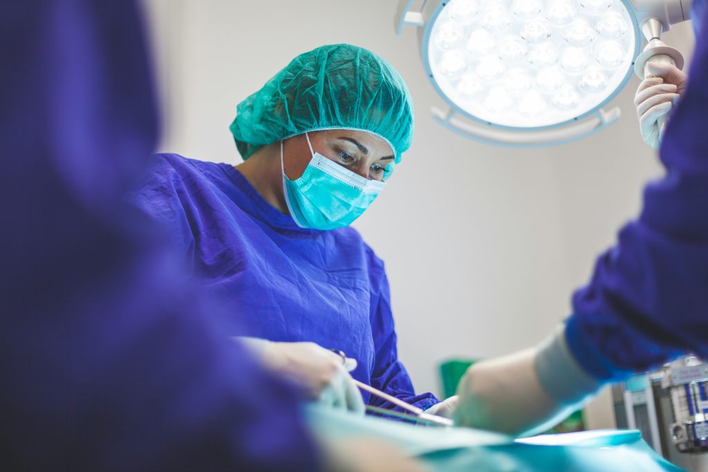 the dentist performs dental intervention under anesthesia