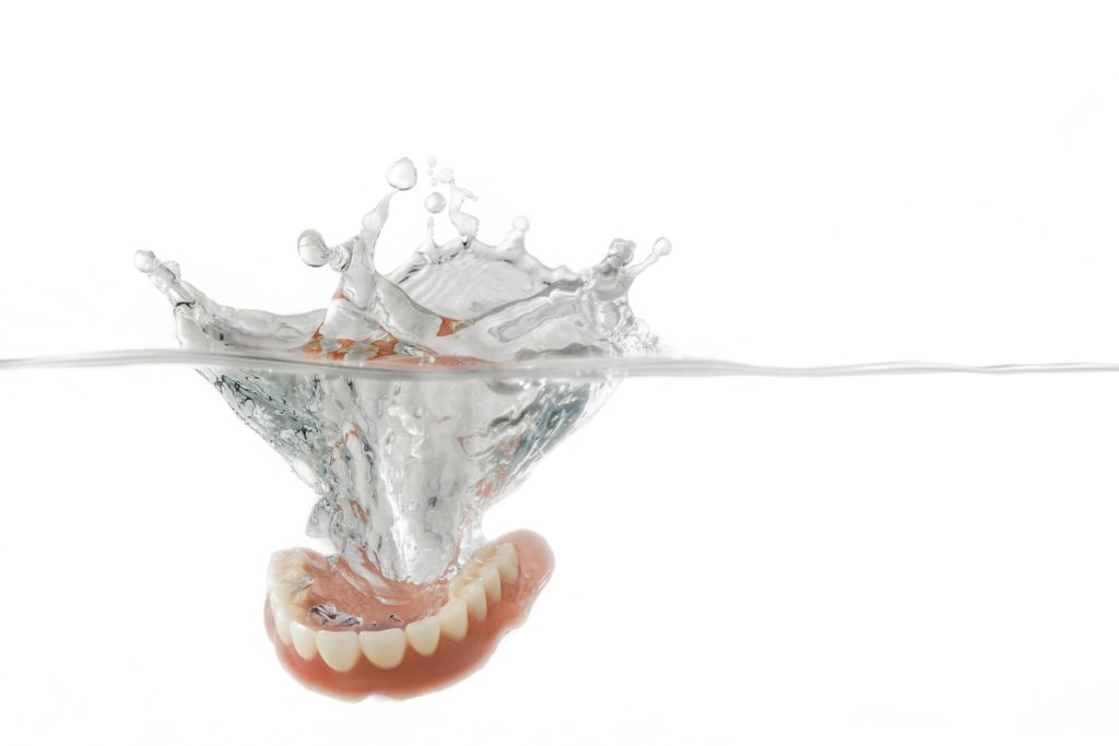 remove plaque from dentures